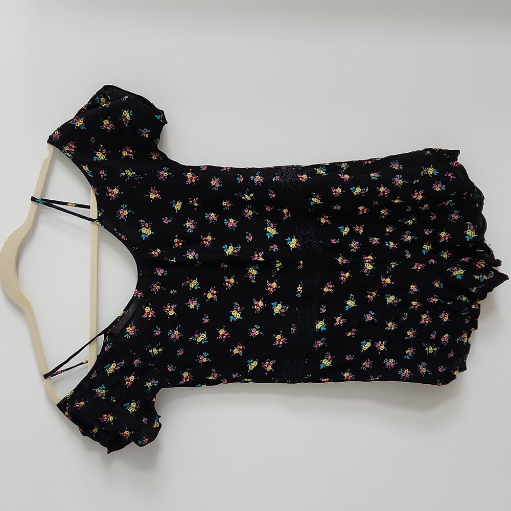 Cold shoulder short sleeve floral romper. Size XS.
